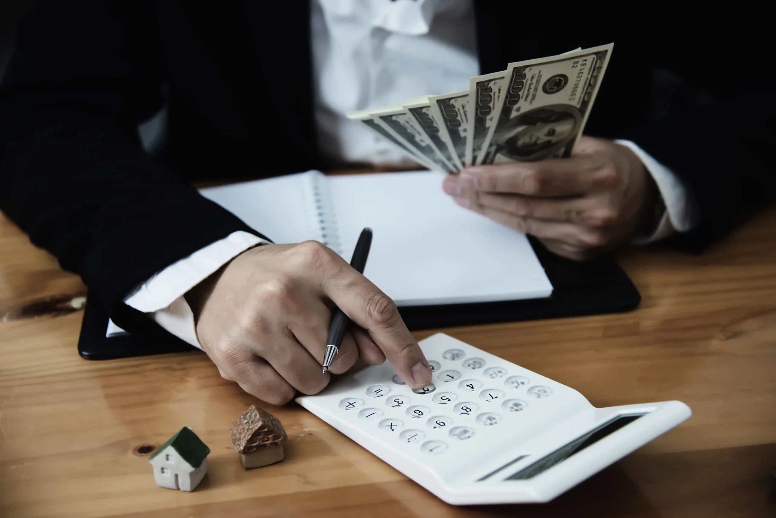 Business man show money bank note make financial plan invite people sell buy house car monetary properties loan credit insurance concept
